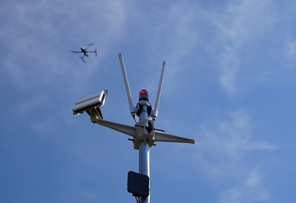 BRINC Responder flying above a EchoGuard ground based radar